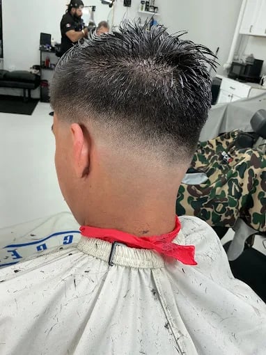 Back of head with fresh fade haircut at barbershop